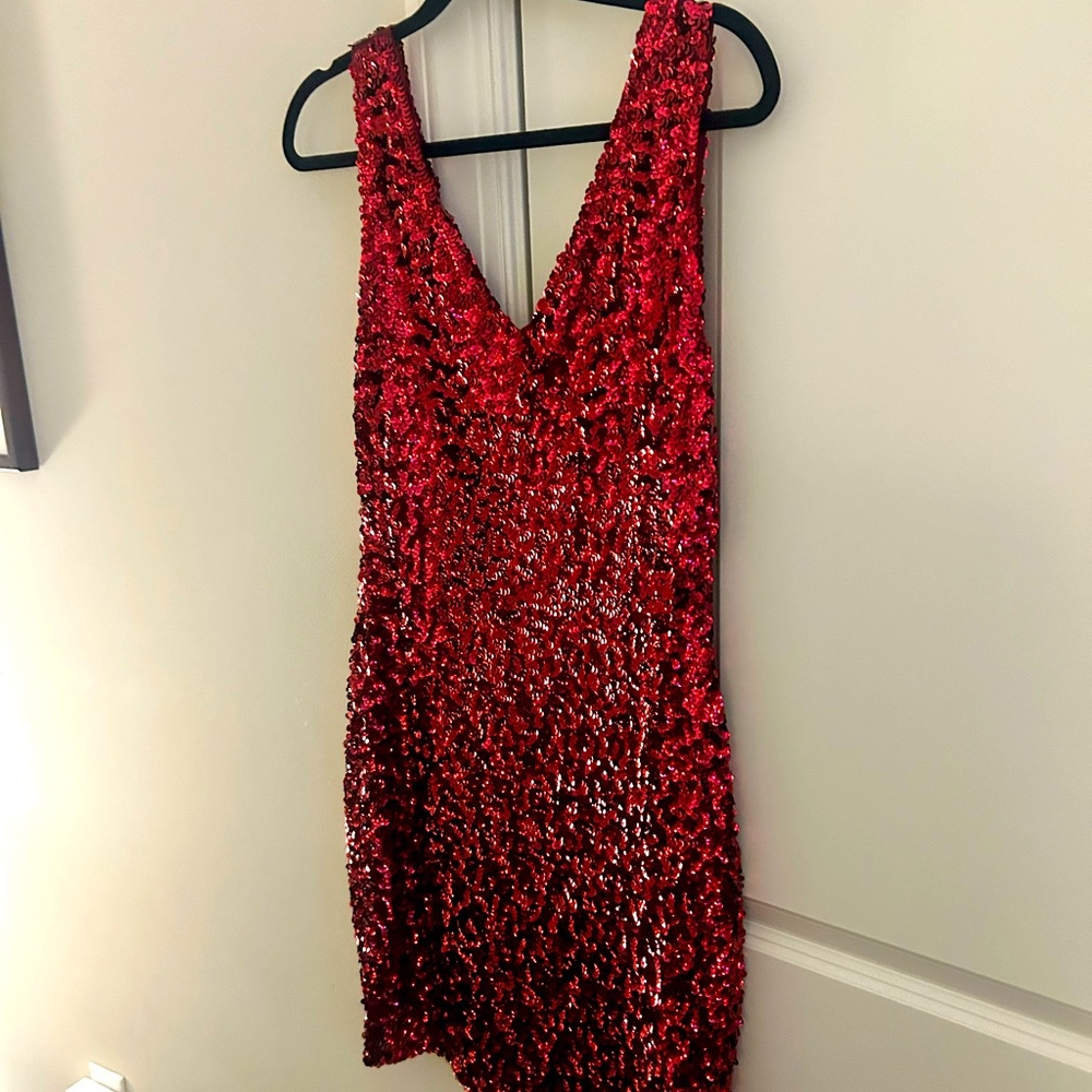 Red sequins short dress.